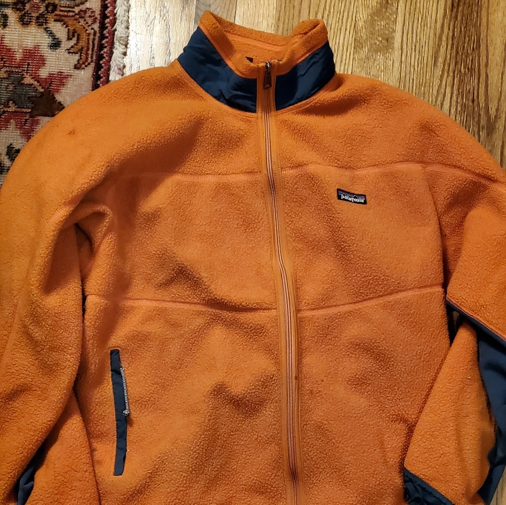Orange Patagonia zip-up fleece jacket
